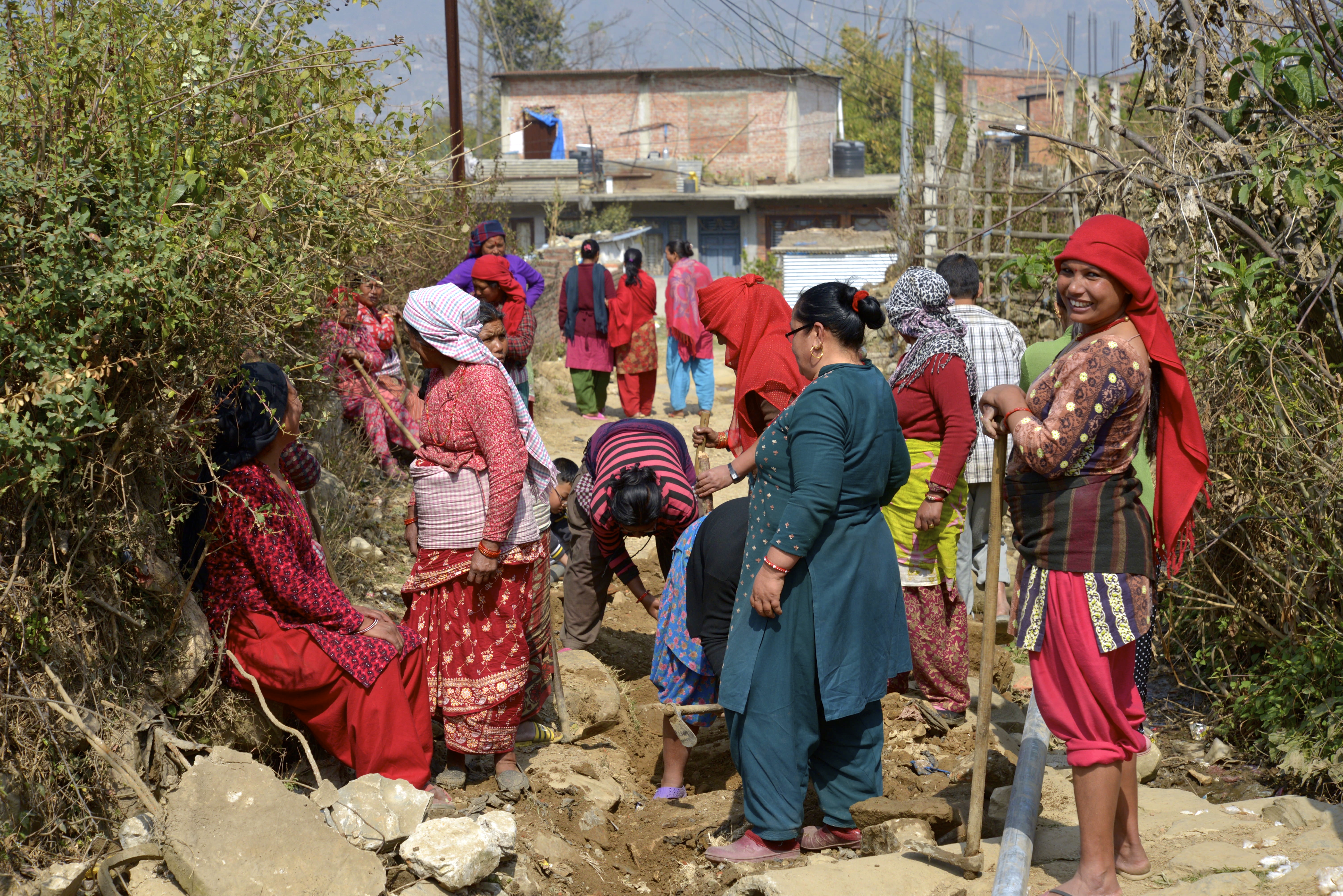 Women building irrigation system in the village of Matatirtha, in Kathmandu District in the Bagmati Zone of central Nepal